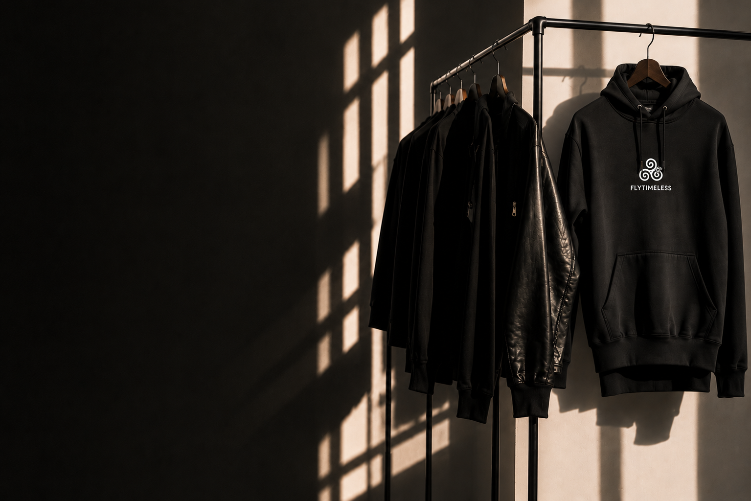 Merch photo — hoodies on a clothing rack